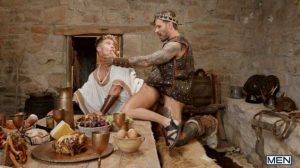 King of the Norsemen Papi Kocic thinks it's just another day, feasting with his fiercest warriors, servant twink Dean Young sitting on his lap and refilling his goblet...